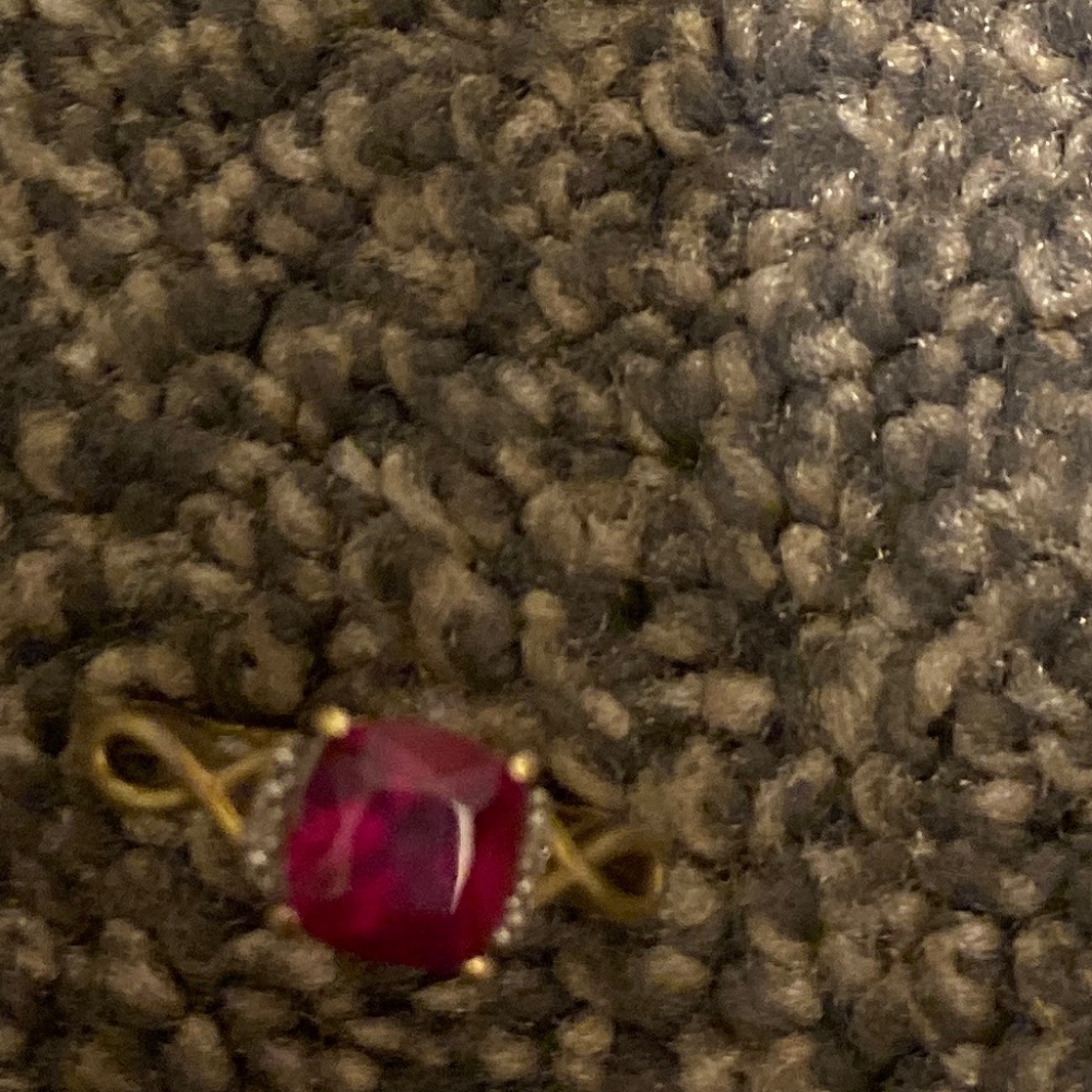 Pink ring with diamonds on the side